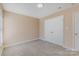 Inviting bedroom featuring neutral walls, carpet, a window for natural light, and a closet for storage at 3230 Richway Ct, Charlotte, NC 28216