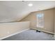 Upstairs bonus room with carpet, natural light from one window, and neutral paint at 3230 Richway Ct, Charlotte, NC 28216