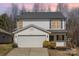 Charming two-story home with a well-maintained lawn, a two-car garage, and beautiful curb appeal at 3230 Richway Ct, Charlotte, NC 28216