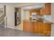 Stylish kitchen boasts a granite island, stainless steel appliances, wood cabinets, and modern tile backsplash at 3230 Richway Ct, Charlotte, NC 28216