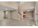 Spacious living room with vaulted ceilings, tile flooring, a fireplace, and staircase at 3230 Richway Ct, Charlotte, NC 28216
