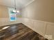 Dining room featuring modern flooring and wainscoting details at 404 Imperial Way, Albemarle, NC 28001