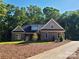 Charming brick home featuring manicured landscaping and a classic architectural design at 404 Imperial Way, Albemarle, NC 28001