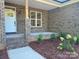 Inviting front porch with brick pillars and tidy landscaping at 404 Imperial Way, Albemarle, NC 28001