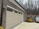 Attached garage boasts an automatic door and concrete driveway at 404 Imperial Way, Albemarle, NC 28001
