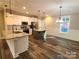 Modern kitchen featuring an island, stainless steel appliances, and stylish pendant lighting at 404 Imperial Way, Albemarle, NC 28001