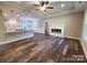 Spacious open-concept living room with fireplace and modern flooring at 404 Imperial Way, Albemarle, NC 28001