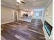 Open-concept living room with fireplace, flowing into modern kitchen at 404 Imperial Way, Albemarle, NC 28001
