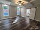 Main bedroom featuring tray ceiling, modern flooring, and bathroom access at 404 Imperial Way, Albemarle, NC 28001