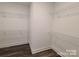 Walk-in closet features hardwood flooring and wired shelving to provide ample storage at 404 Imperial Way, Albemarle, NC 28001