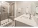 Modern bathroom with a glass-enclosed shower, dual sinks, and elegant finishes at 4548 Millennium Ave, Charlotte, NC 28217