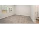 Bedroom with plush carpet, windows for natural light, and an en-suite bathroom at 4548 Millennium Ave, Charlotte, NC 28217