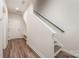 Welcoming entryway with hardwood floors, a staircase, and ample natural light at 4548 Millennium Ave, Charlotte, NC 28217