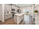 Modern kitchen with stainless steel appliances, a large island, and sliding doors to the patio at 4548 Millennium Ave, Charlotte, NC 28217