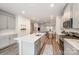 Bright kitchen with stainless steel appliances, large island with sink, and open floor plan at 4548 Millennium Ave, Charlotte, NC 28217