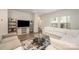 Bright and airy living room with neutral tones, plush seating, and large windows at 4548 Millennium Ave, Charlotte, NC 28217