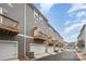 Rear exterior view of townhomes with attached garages and private balconies at 4548 Millennium Ave, Charlotte, NC 28217