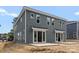 Rear exterior of home with sliding glass doors that open to patios at 507 Bowman Rd, Charlotte, NC 28217