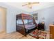 Bedroom with bunk bed and light wood flooring, sports-themed decor at 509 Sumter St, Lancaster, SC 29720