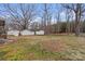 Large backyard featuring multiple storage sheds at 512 Rhodes Ave, Kings Mountain, NC 28086