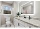 Updated bathroom with granite counters, modern fixtures, decorative mirror, and bright vanity at 512 Rhodes Ave, Kings Mountain, NC 28086