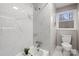 Bright bathroom with a marble-tiled shower, modern fixtures, and a window overlooking a beautiful landscape at 512 Rhodes Ave, Kings Mountain, NC 28086