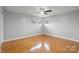 Bright bedroom featuring hardwood floors, a ceiling fan, and natural light at 512 Rhodes Ave, Kings Mountain, NC 28086