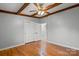 Spacious bedroom featuring hardwood floors, a ceiling fan, and a double door closet at 512 Rhodes Ave, Kings Mountain, NC 28086