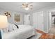 Bright bedroom featuring hardwood floors, a ceiling fan, and a double door closet at 512 Rhodes Ave, Kings Mountain, NC 28086