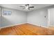 Bright bedroom featuring hardwood floors, a ceiling fan, and natural light at 512 Rhodes Ave, Kings Mountain, NC 28086