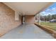 Covered carport area with brick columns, providing ample space for parking at 512 Rhodes Ave, Kings Mountain, NC 28086