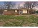 Charming brick ranch home featuring a well-manicured lawn and covered carport at 512 Rhodes Ave, Kings Mountain, NC 28086