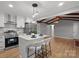 Beautiful kitchen featuring stainless appliances, white cabinetry, and island with seating and modern lighting at 512 Rhodes Ave, Kings Mountain, NC 28086