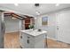Bright kitchen with stainless appliances, modern pendant lighting and island featuring bar seating at 512 Rhodes Ave, Kings Mountain, NC 28086