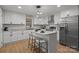 Updated kitchen with island seating, granite counters, stainless steel appliances, and modern lighting at 512 Rhodes Ave, Kings Mountain, NC 28086