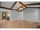Open concept living room featuring vaulted ceilings, hardwood floors, and natural light at 512 Rhodes Ave, Kings Mountain, NC 28086