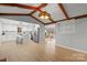 Open living room and kitchen layout featuring wood floors, modern lighting, and access to other living areas at 512 Rhodes Ave, Kings Mountain, NC 28086