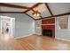 Spacious living room featuring vaulted ceilings, hardwood floors, and a brick fireplace at 512 Rhodes Ave, Kings Mountain, NC 28086