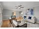 Cozy living room with hardwood floors, stylish furniture, and a ceiling fan at 512 Rhodes Ave, Kings Mountain, NC 28086