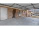Covered patio with brick accent, exterior door and access to the backyard at 512 Rhodes Ave, Kings Mountain, NC 28086