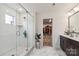 Modern bathroom with a glass-enclosed shower, double vanity, and stylish tile flooring at 531 Red Wolf Ln, Clover, SC 29710