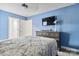 Inviting blue bedroom featuring neutral paint, carpet, a TV, and bright natural light at 531 Red Wolf Ln, Clover, SC 29710