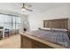 Cozy bedroom featuring a large window with curtains, neutral paint, carpet, and a spacious wood bed at 531 Red Wolf Ln, Clover, SC 29710