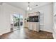 Bright dining area with a large aquarium, sliding glass doors to the backyard and hardwood floors at 531 Red Wolf Ln, Clover, SC 29710
