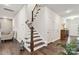 View of a hallway leading to a staircase with wooden trim and hardwood floors at 531 Red Wolf Ln, Clover, SC 29710