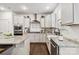 Bright kitchen showcasing white cabinets, subway tile backsplash, stainless steel appliances, and granite countertops at 531 Red Wolf Ln, Clover, SC 29710