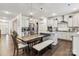 Open kitchen with white cabinets, stainless steel appliances, granite countertops, and a large island with a breakfast bar at 531 Red Wolf Ln, Clover, SC 29710