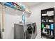 Laundry room featuring a modern washer and dryer, shelving, and essential cleaning supplies at 531 Red Wolf Ln, Clover, SC 29710