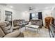 Living room with gray leather seating, a ceiling fan, and a bright window at 531 Red Wolf Ln, Clover, SC 29710