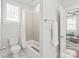 Bright bathroom featuring a tub/shower combo and a convenient towel rack near the doorway at 5717 Closeburn Rd, Charlotte, NC 28210